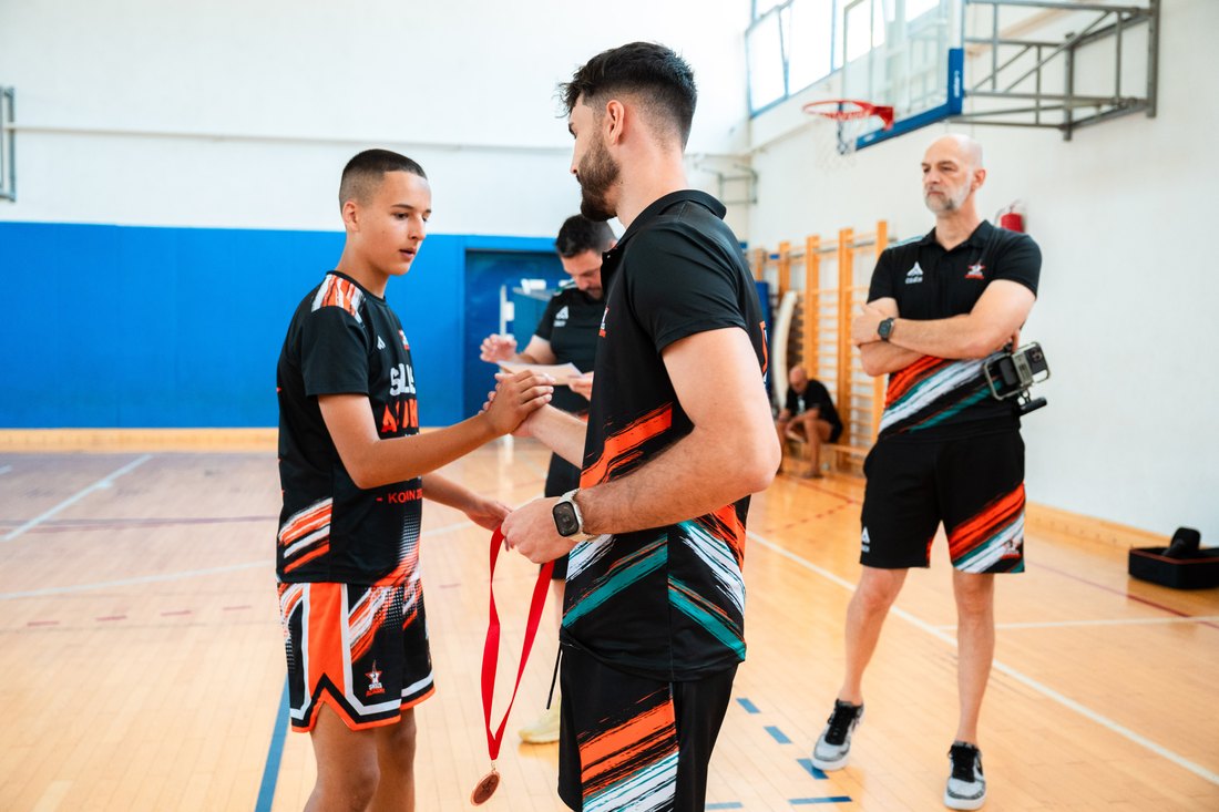 A camper finishing at the rim during a Skills Academy session