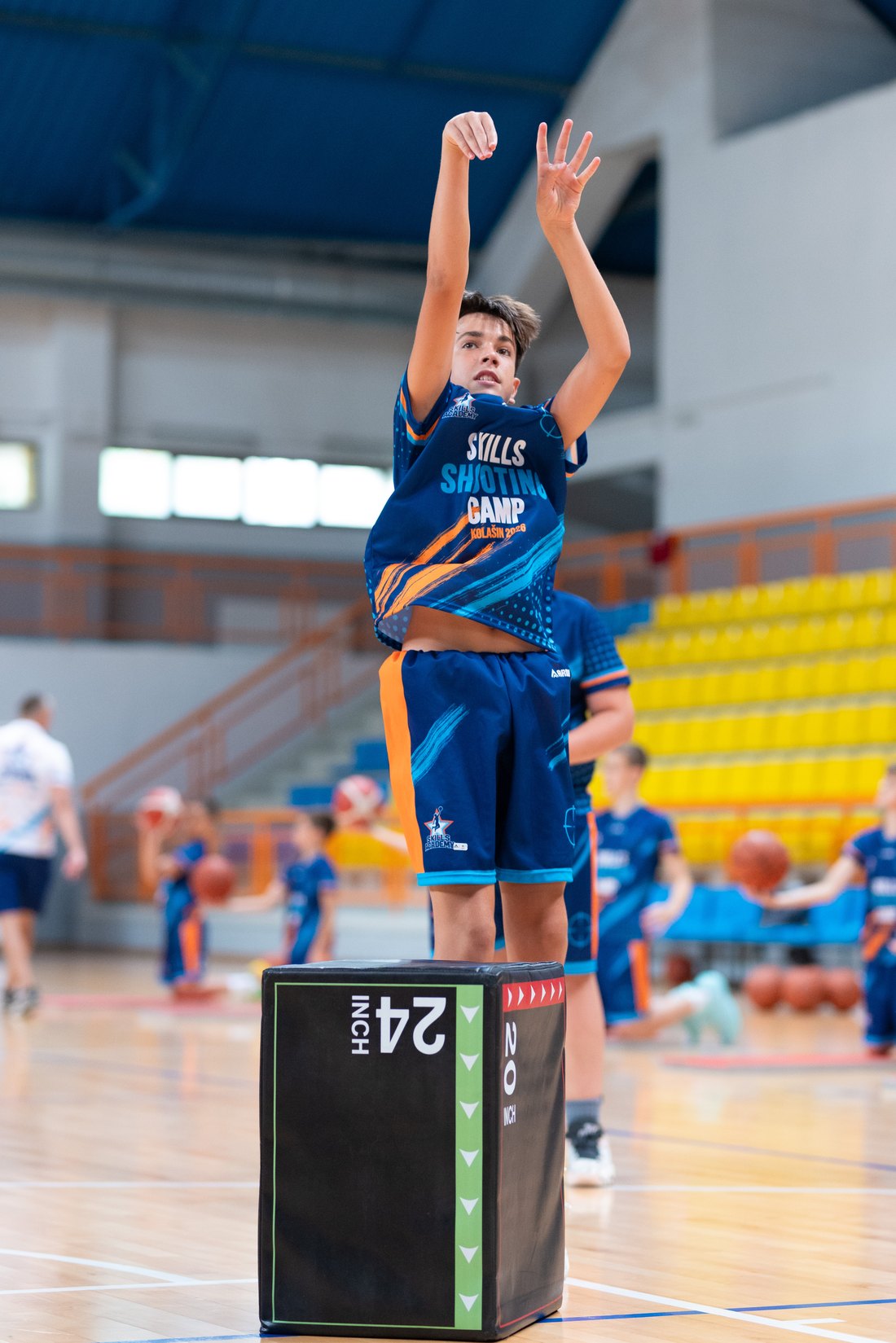 A camper finishing at the rim during a Skills Academy session